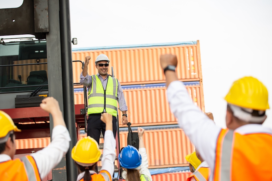 image showing team celebrating after challenges machinery movers face